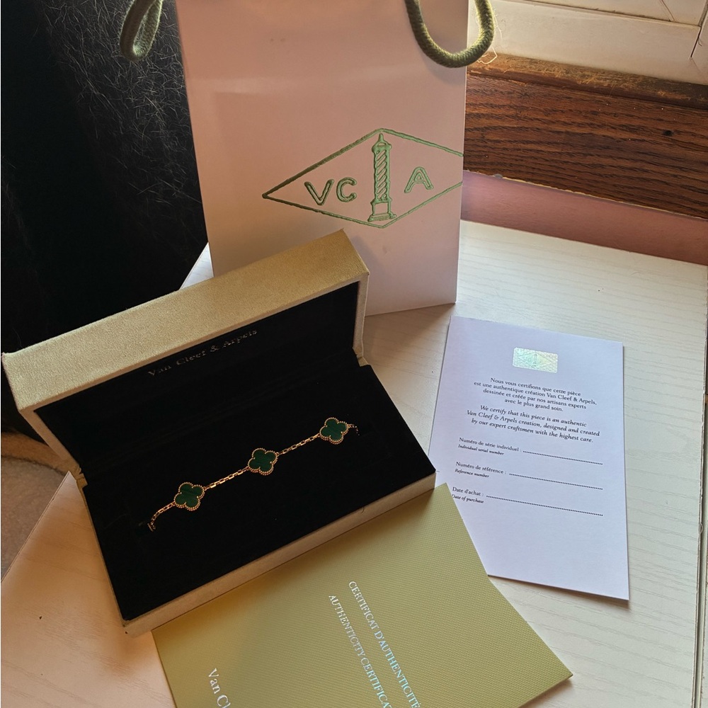 Van Cleef & Arpels Gold Bracelet with Green Clover Charms